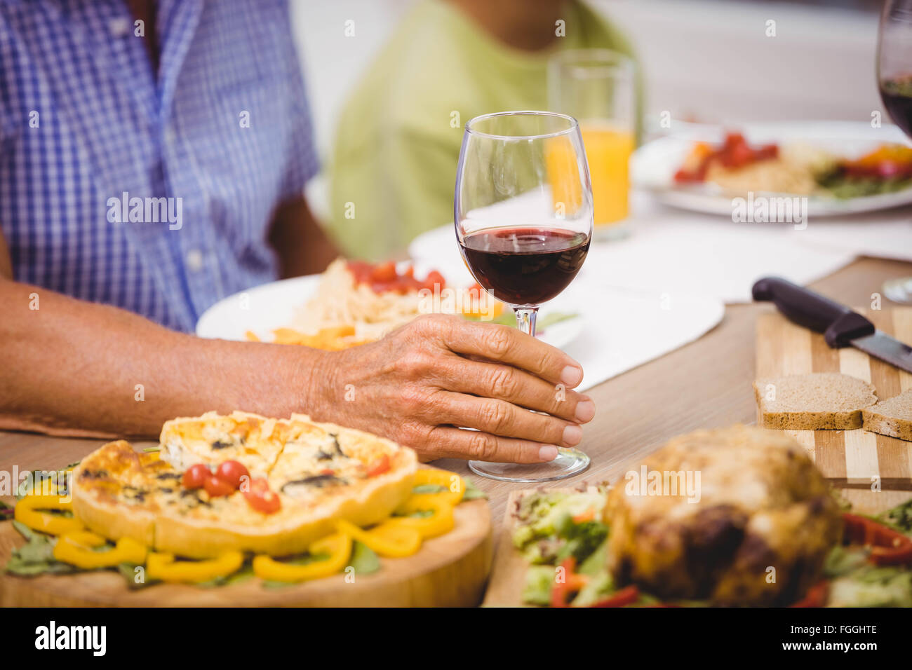 Glass of wine on dining table Stock Photo - Alamy
