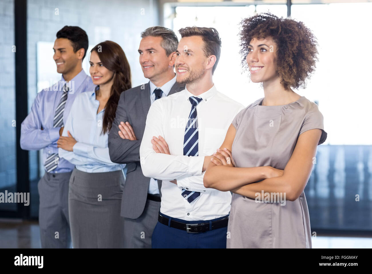 Confident business team in office Stock Photo - Alamy