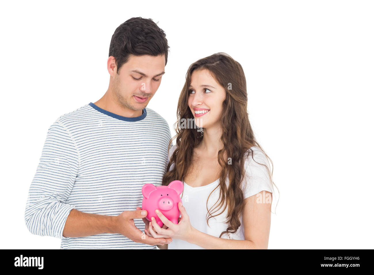 Couple holding piggy bank Stock Photo - Alamy