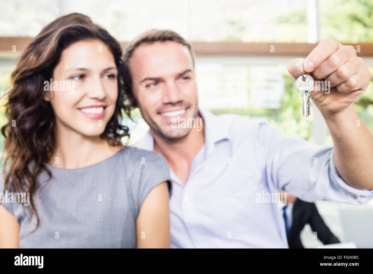 Happy young couple holding new house key Stock Photo - Alamy