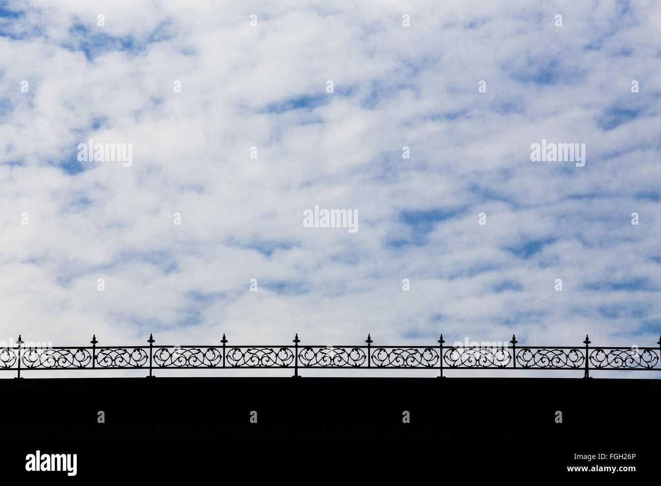 Bridge railing made of iron creates an interesting abstract of materials and sky in California Stock Photo