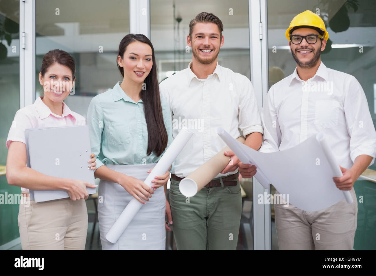 Casual architects smiling at camera Stock Photo - Alamy