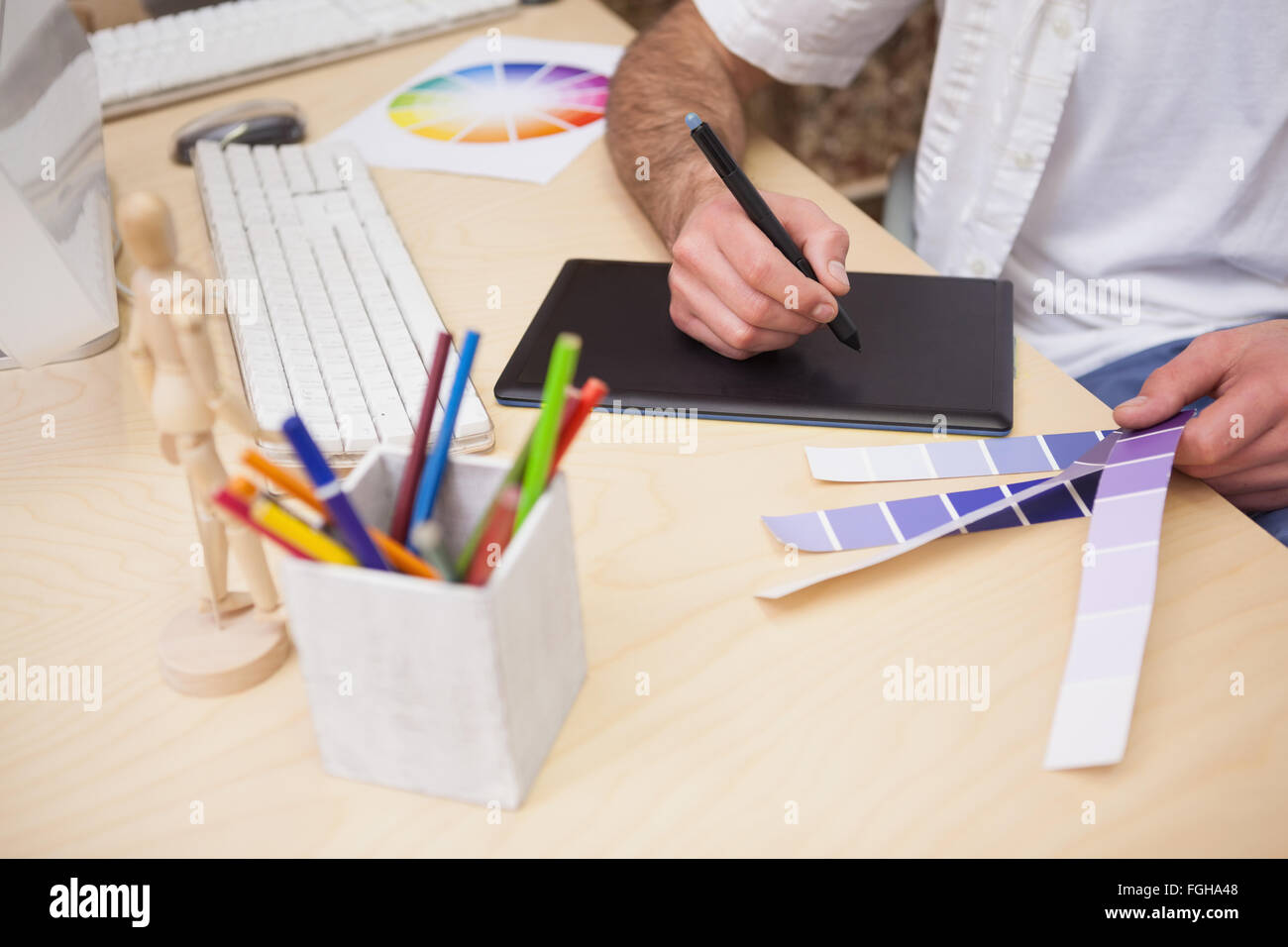 Artist drawing something on graphic tablet Stock Photo - Alamy