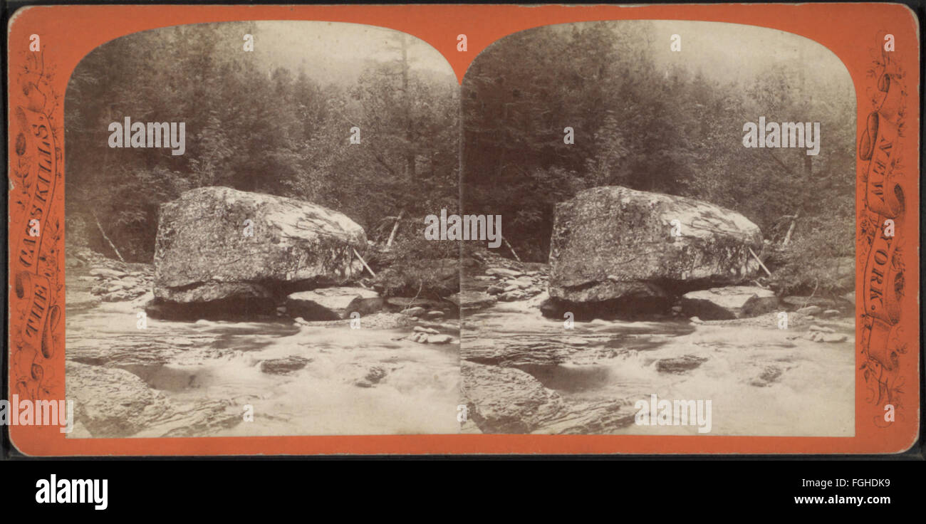 Photograph by J. Loeffler showing a large boulder above the Artist's Grotto in Palensville, capturing the unique rock formation. Stock Photo