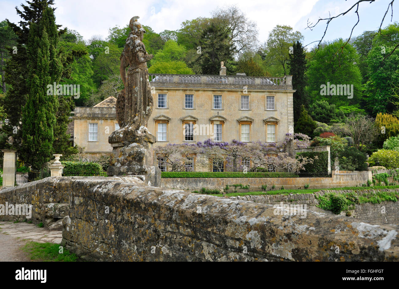 Statue on bridge over the river Frome at Iford Manor near Bath, UK Stock Photo