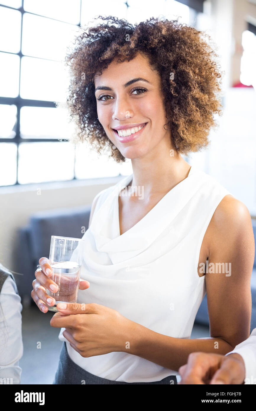 Businesswoman having a glass of water Stock Photo Alamy
