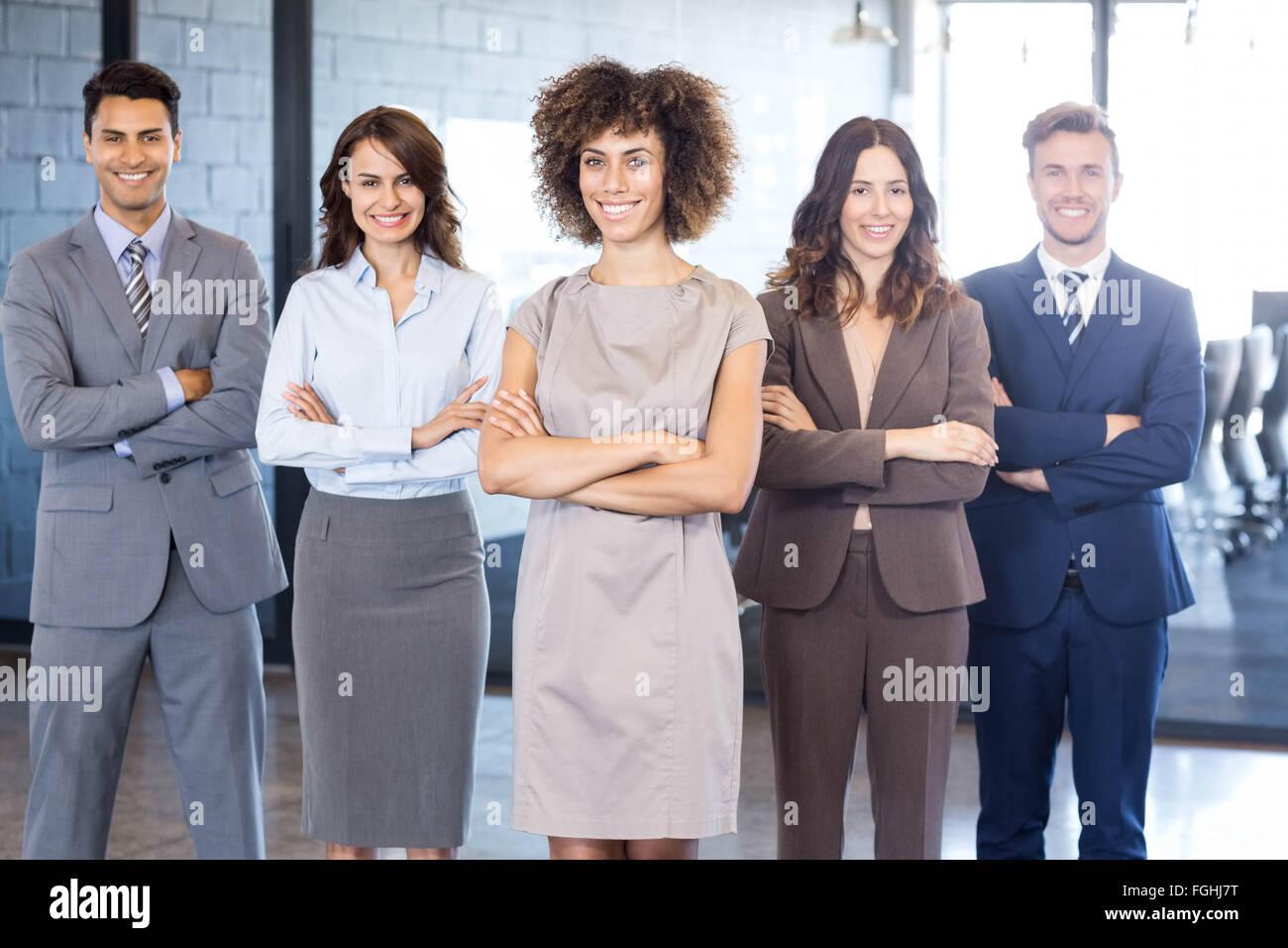 Portrait of confident business team in office Stock Photo - Alamy