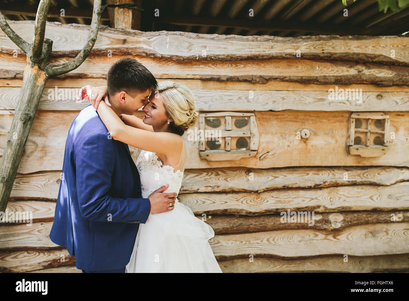 beautiful young wedding couple stands near house Stock Photo Alamy