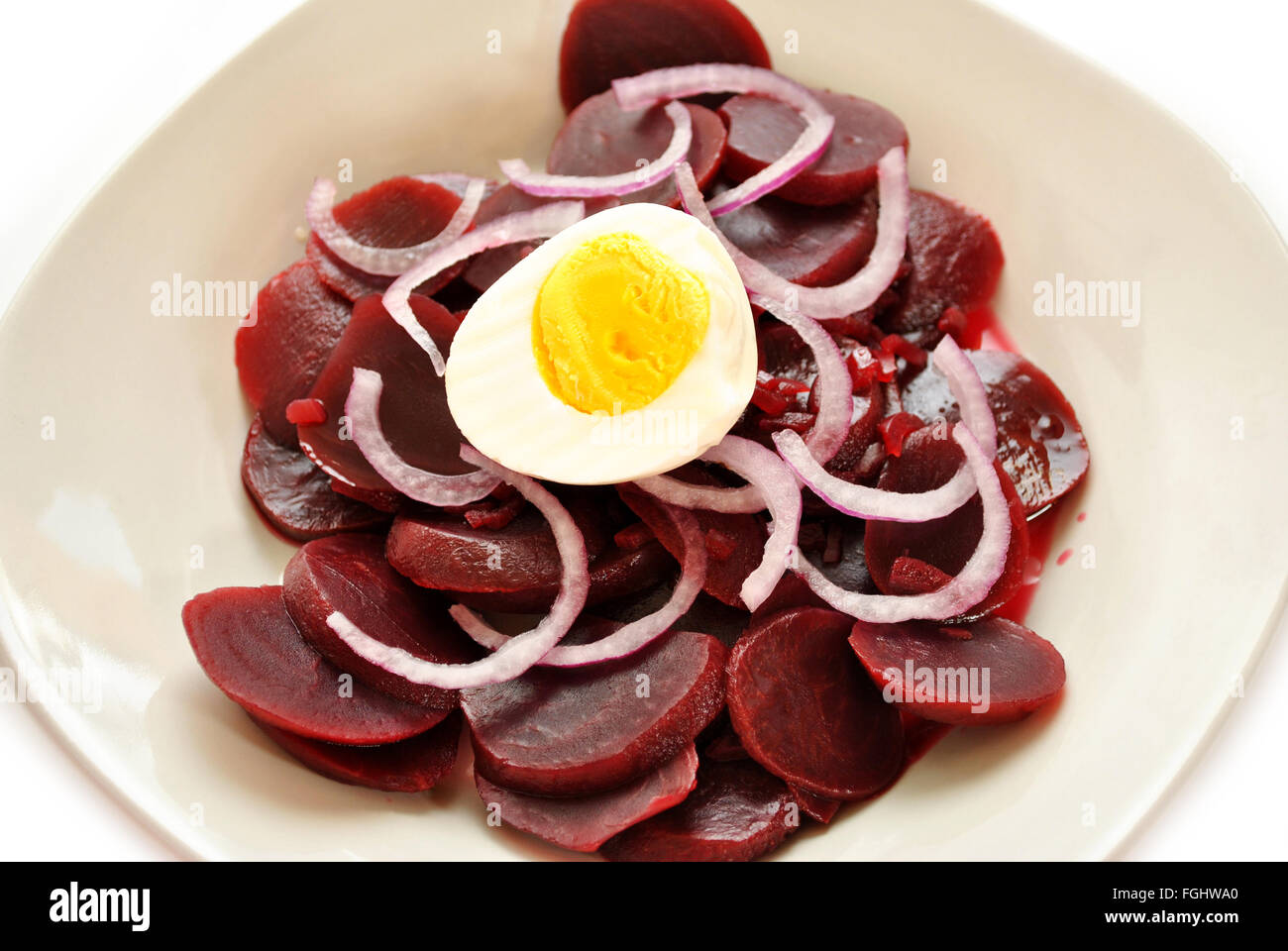 Beets, Onions and Boiled Egg Salad Served in a Bowl Stock Photo