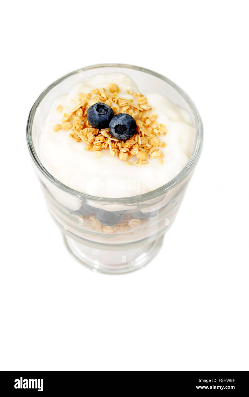 Glass Container Filled with Yogurt, Berries and Oats Stock Photo