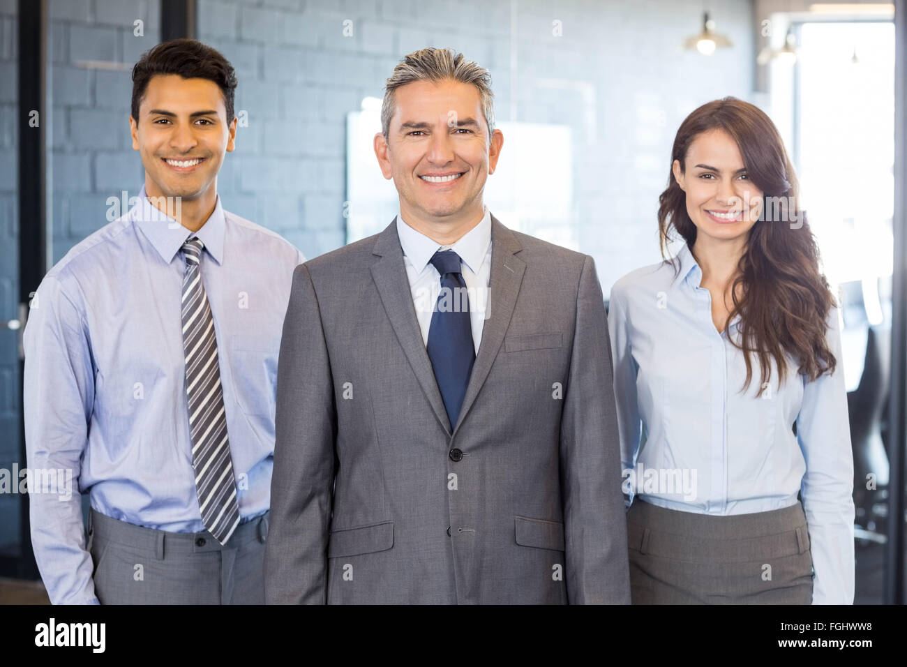 Portrait of confident business team Stock Photo - Alamy