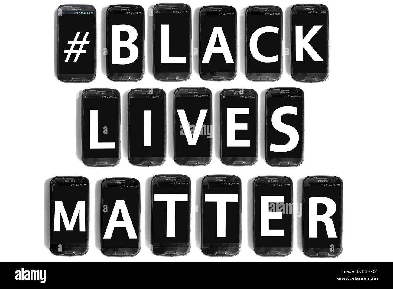 The hashtag #BlackLivesMatter written on smartphone screens photographed against a white background. Stock Photo