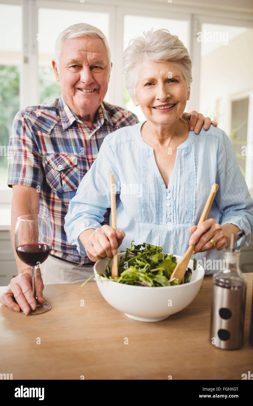 Senior couple preparing salad Stock Photo