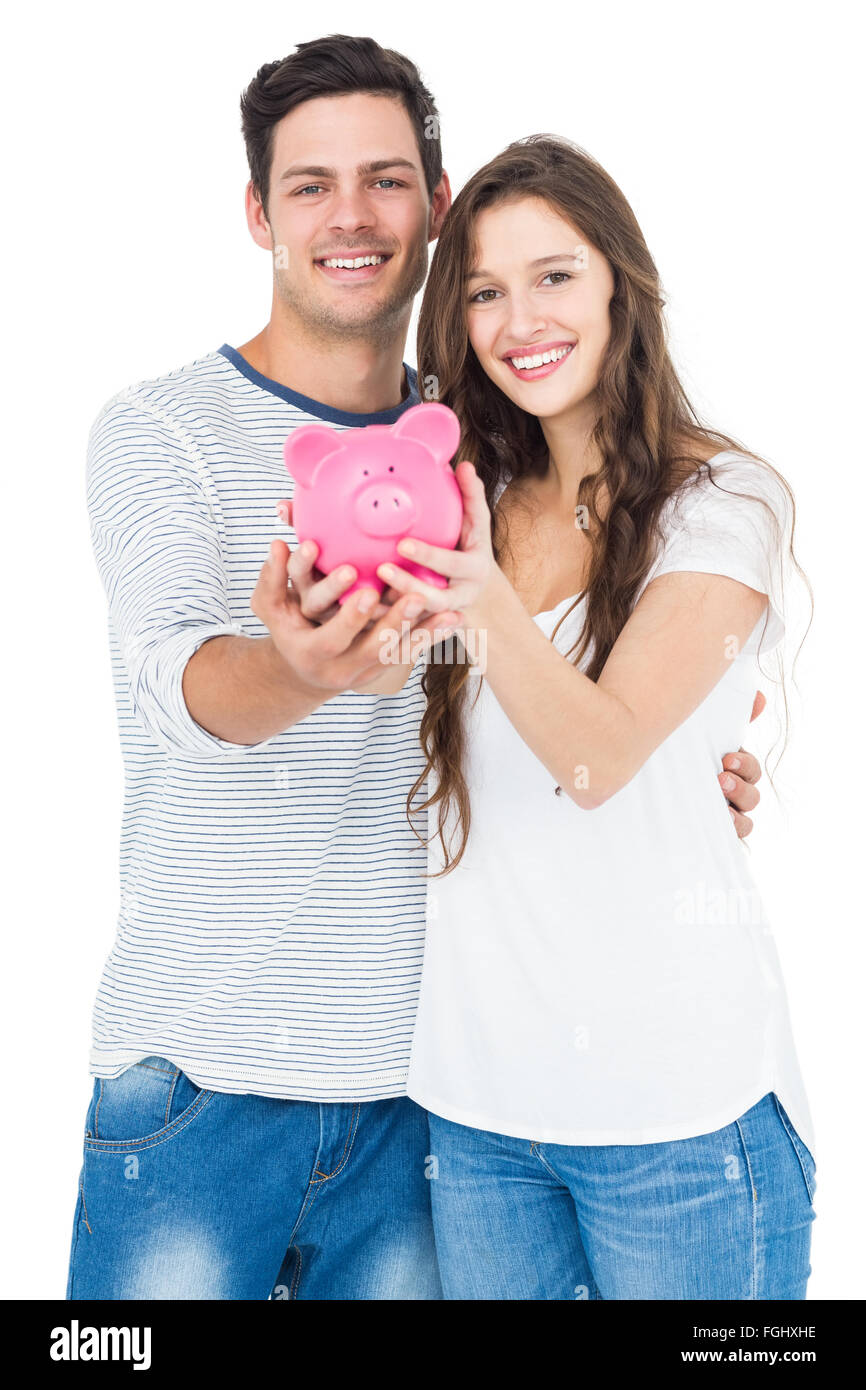 Couple holding piggy bank Stock Photo - Alamy