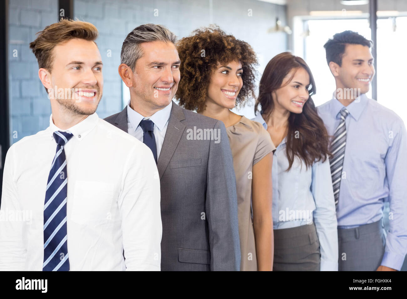 Confident business team in office Stock Photo - Alamy