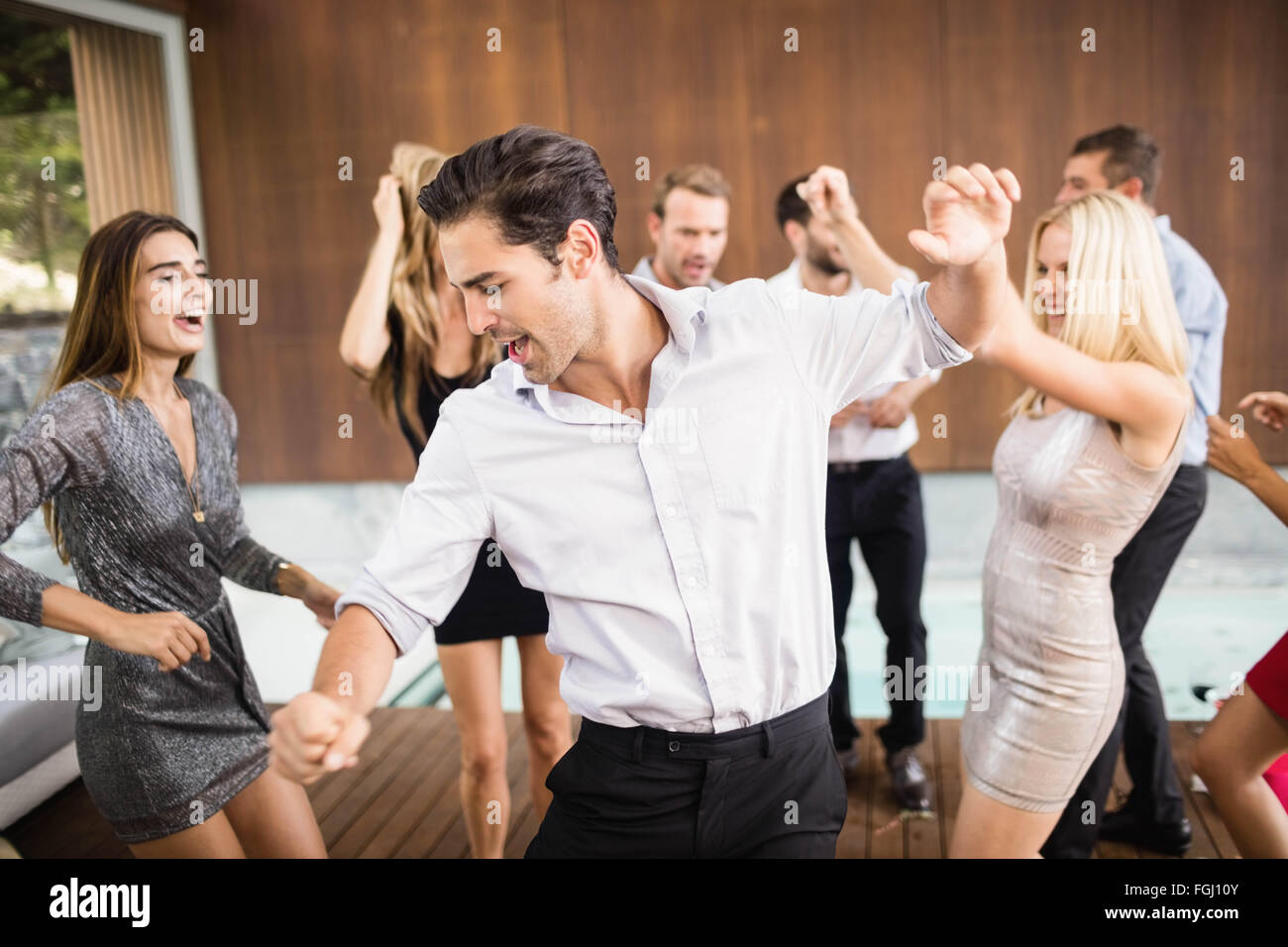 Group of young friends dancing Stock Photo - Alamy