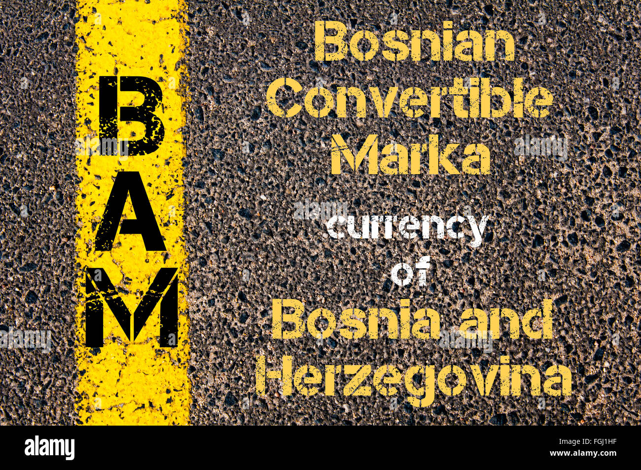 Concept image of Acronym BAM - Bosnian Convertible Marka, currency of Bosnia and Herzegovina written over road marking yellow paint line Stock Photo
