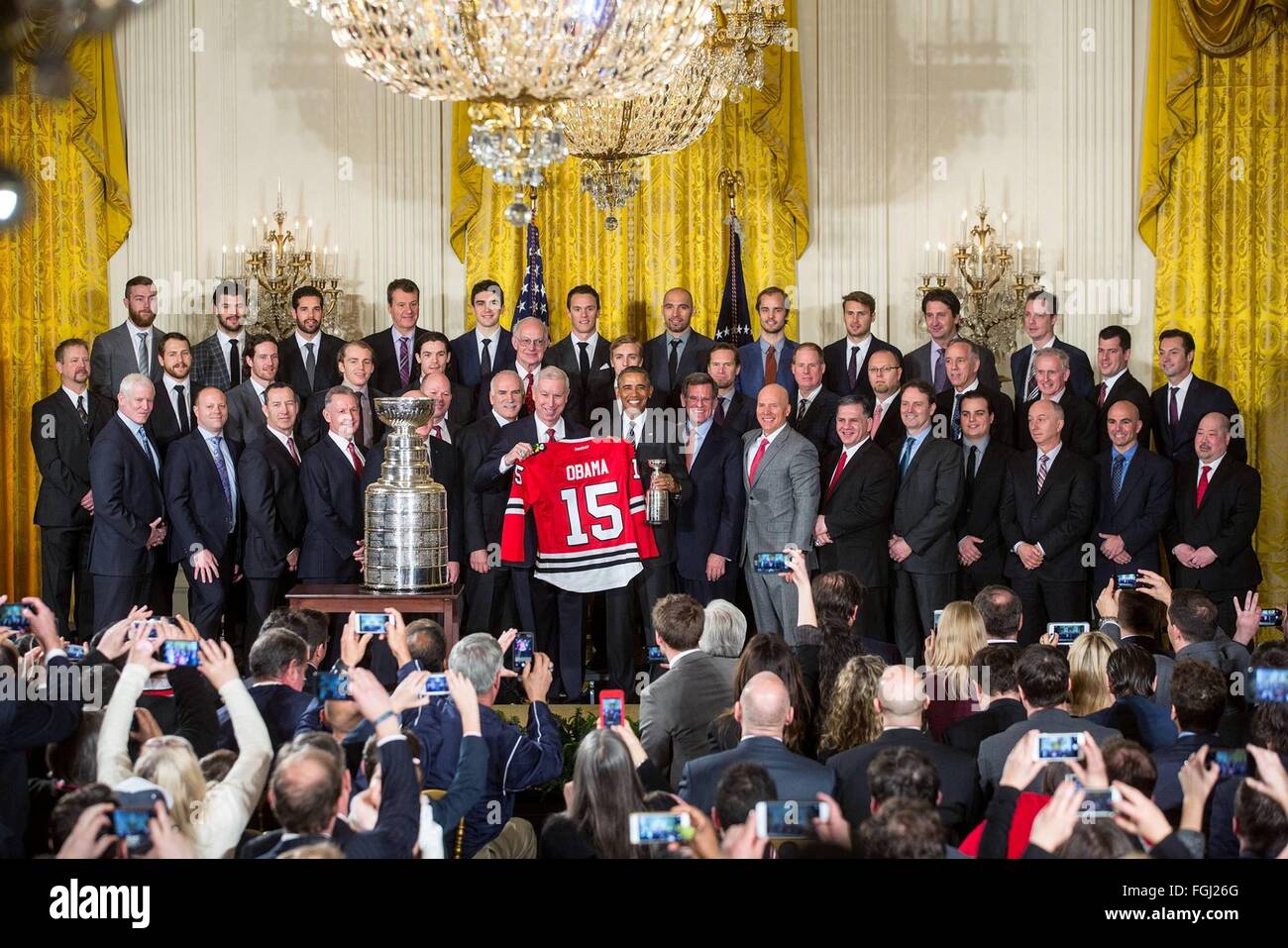 Washington DC, USA. 18th February, 2016. U.S. President Barack Obama poses with players during a ceremony to honor the 2015 NHL Stanley Cup Champion Chicago Blackhawks in the East Room of the White House February 18, 2016 in Washington, DC. Stock Photo