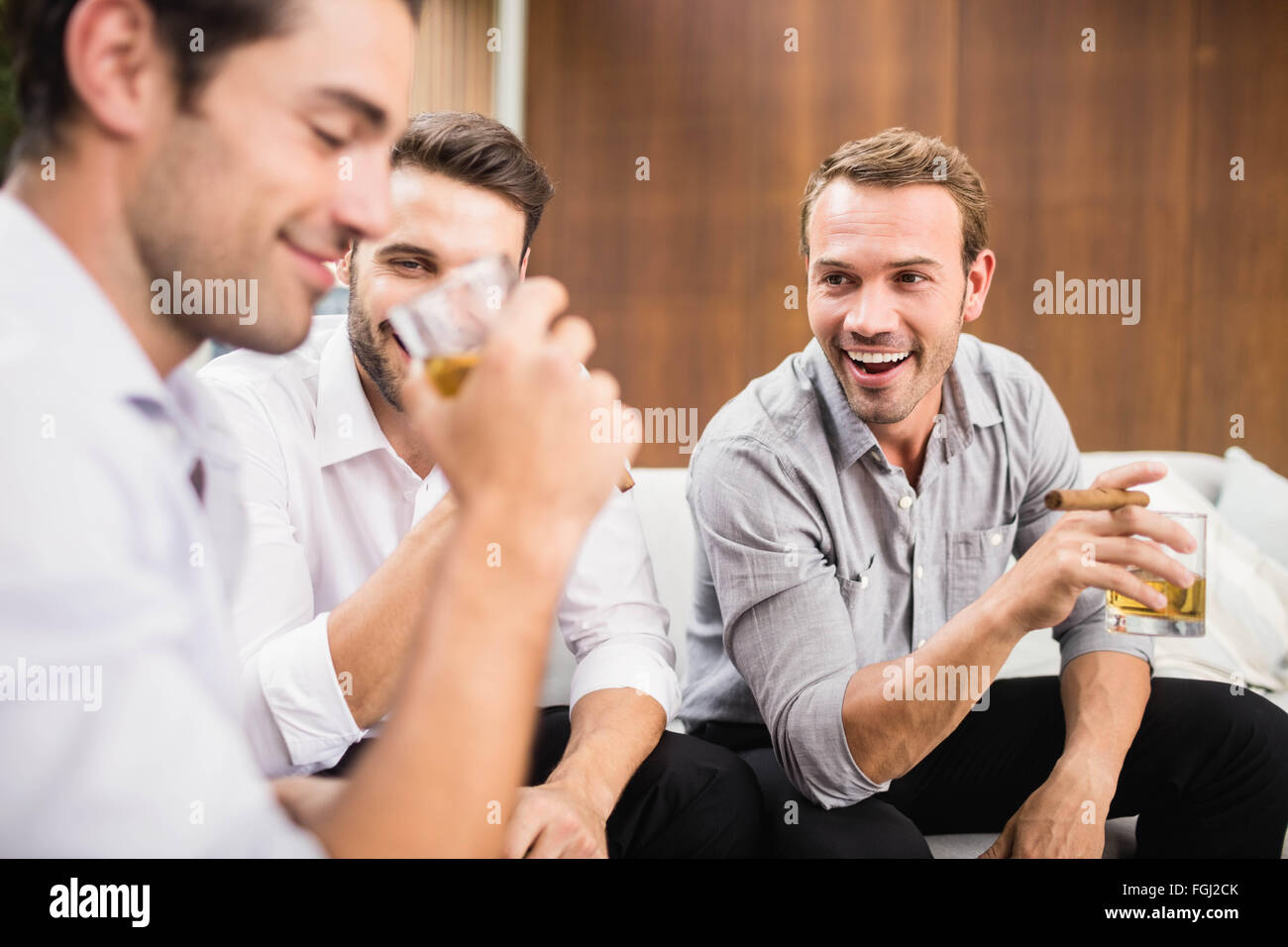 Group of men having cocktail drinks Stock Photo