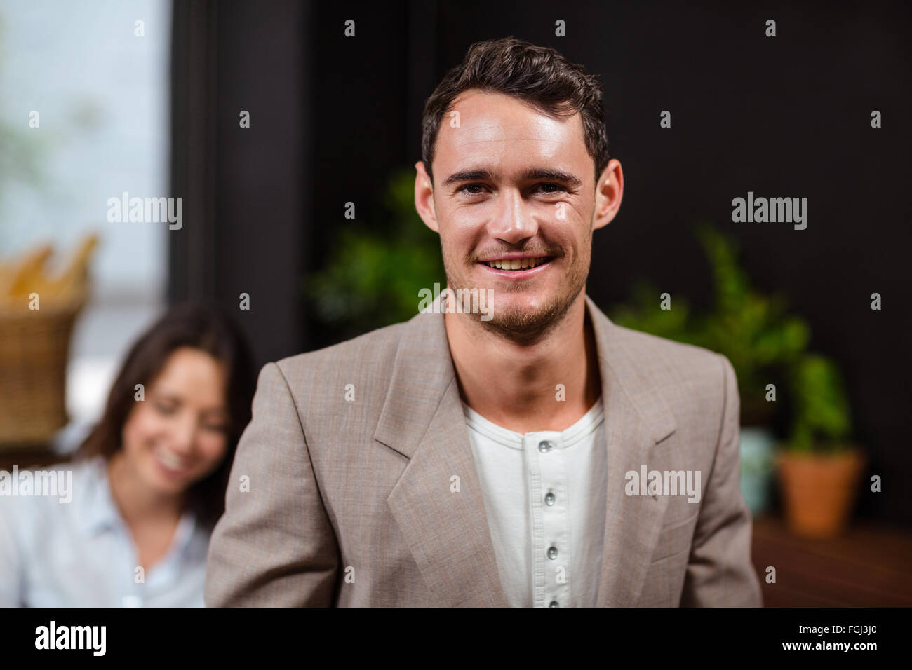 Smiling man looking at camera Stock Photo - Alamy