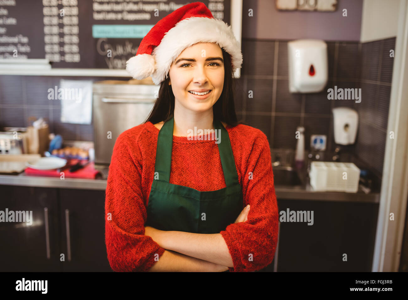 Cute waitress standing behind the counter Stock Photo Alamy