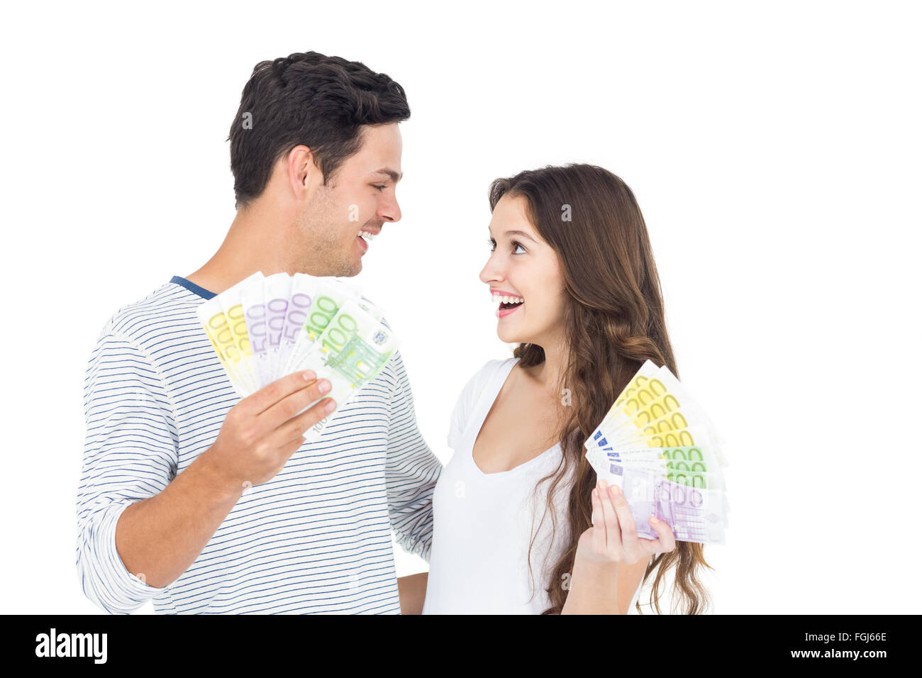 Happy couple holding money Stock Photo - Alamy
