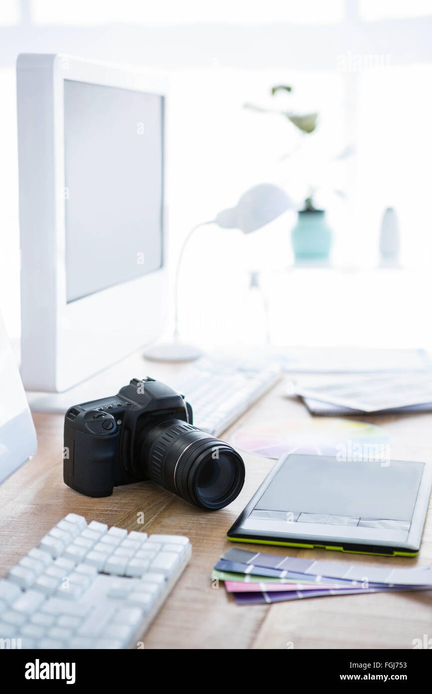 digital camera on an office desk Stock Photo - Alamy