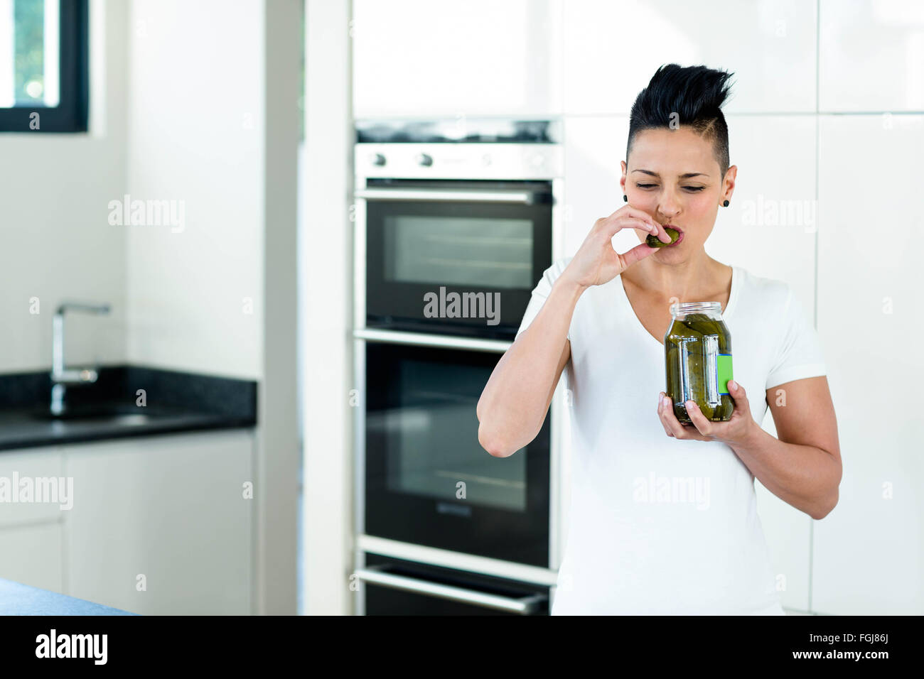 Pregnant woman eating pickles Stock Photo Alamy