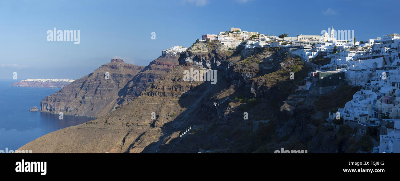 SANTORINI, GREECE - 2015: The Fira and Firostefani in morning light and the Scaros castle, Imerovigli and Oia on the background Stock Photo