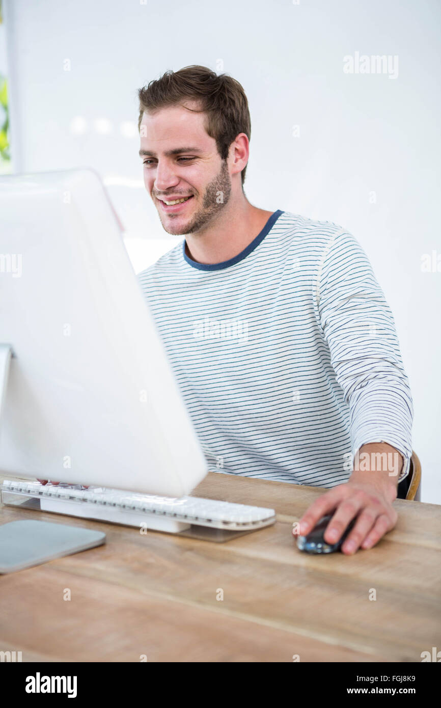 Handsome man working on computer Stock Photo - Alamy