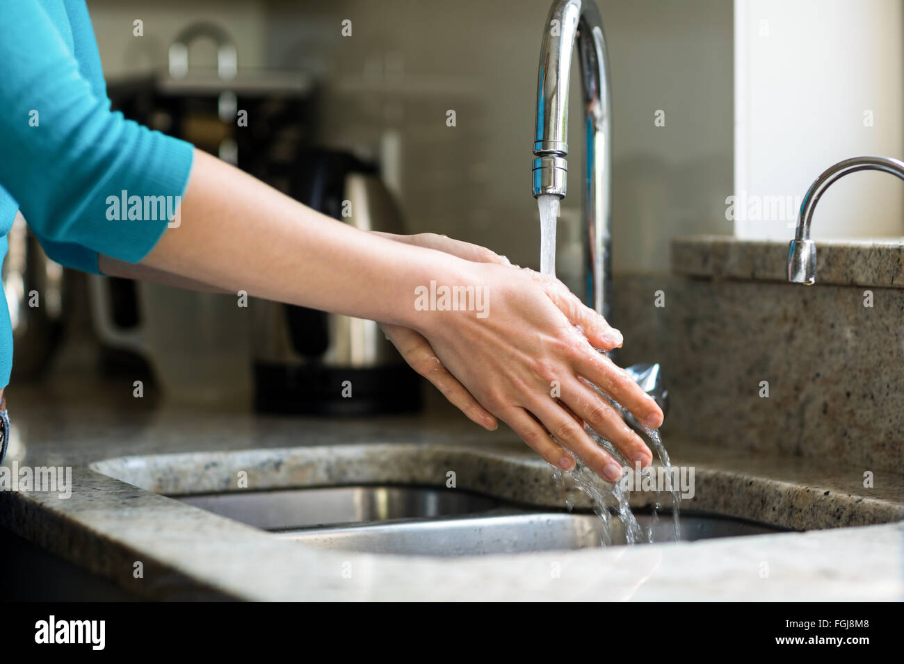 Pretty woman washing her hands Stock Photo