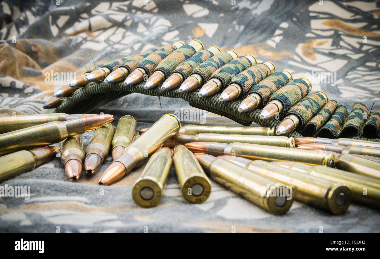 hollow point ammunitions for rifle on camouflage background. Stock Photo
