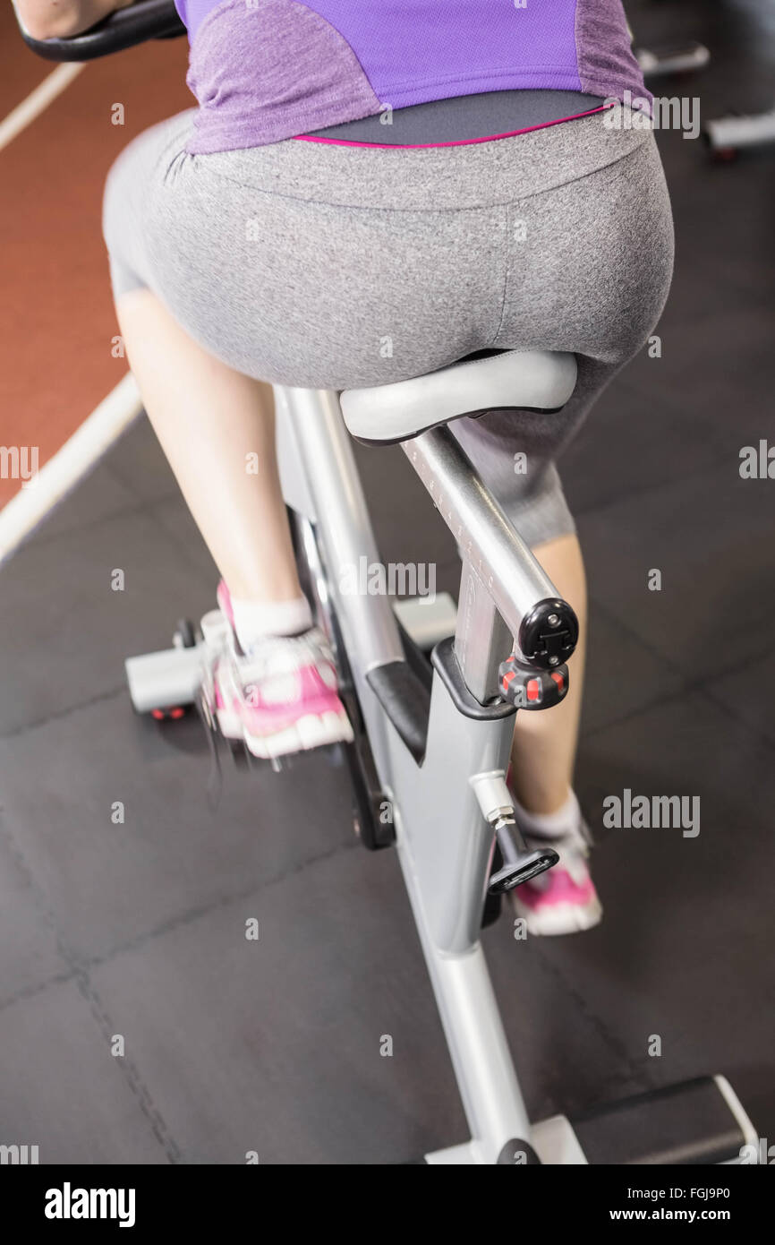 Pregnant woman using exercise bike Stock Photo Alamy