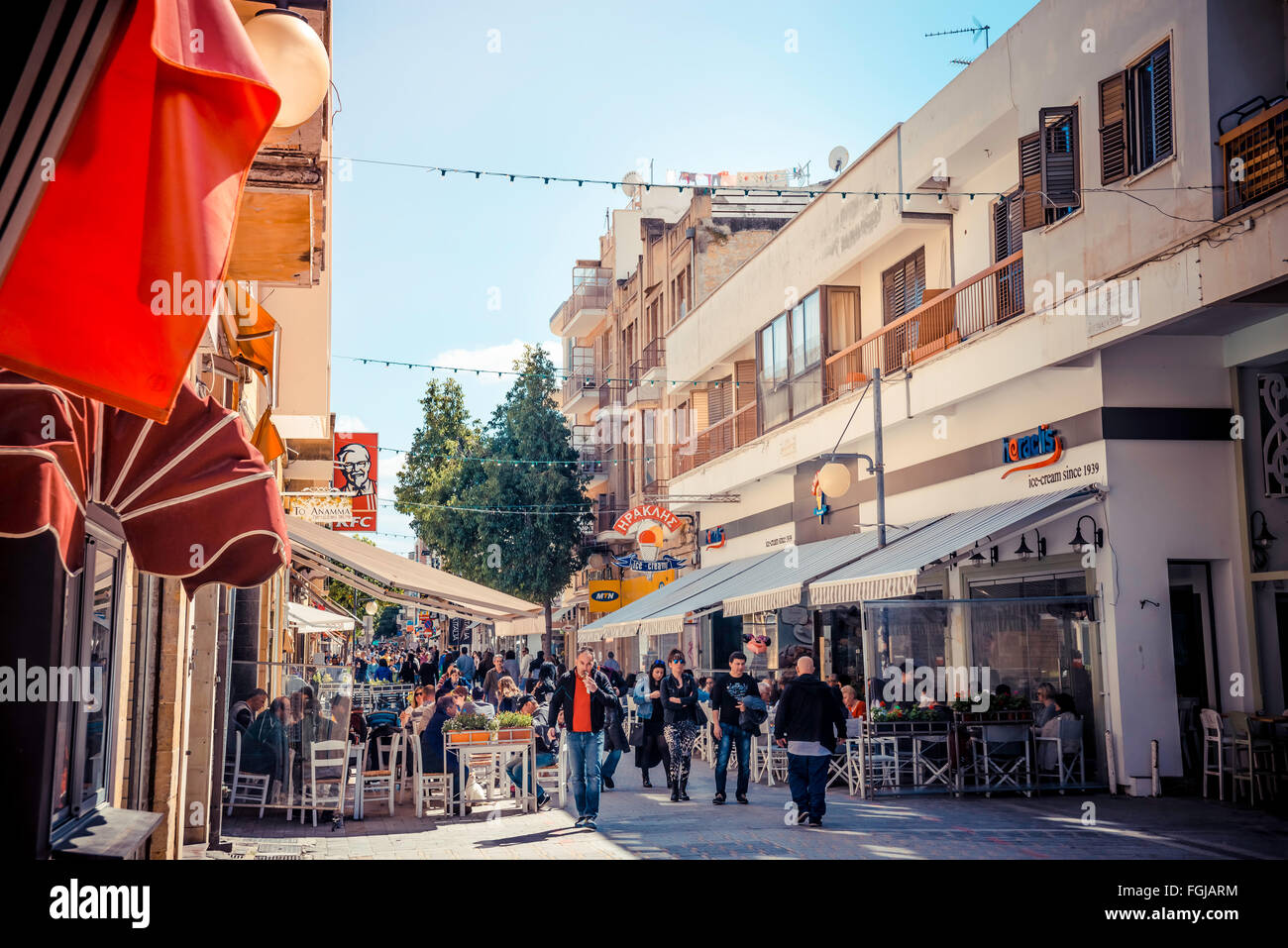 NICOSIA - APRIL 13 : People walking on Ledra street on April 13, 2015 in Nicosia, Cyprus. It is is a major shopping thoroughfare Stock Photo