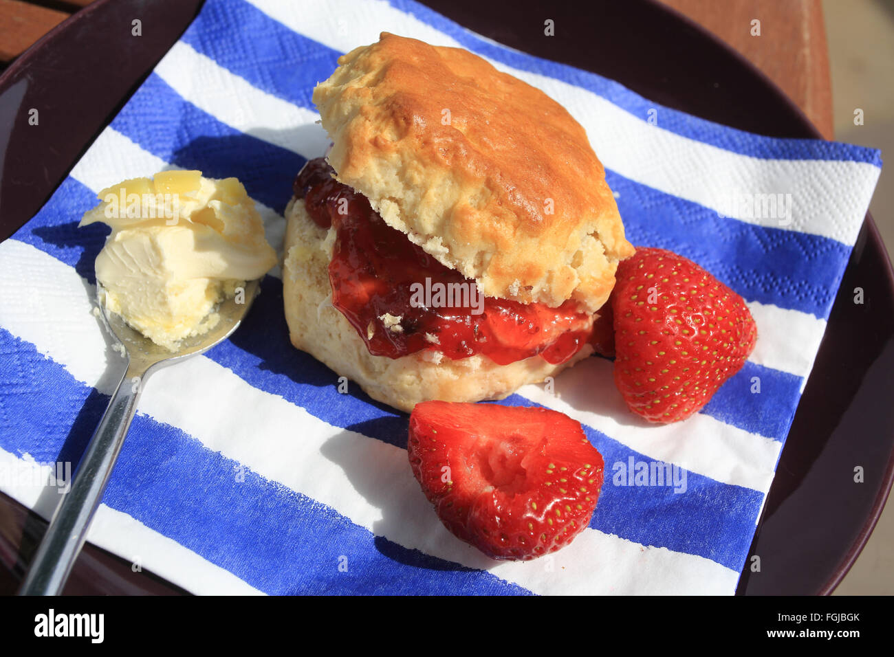 An English cream tea served in the garden on a summer's day, in the UK