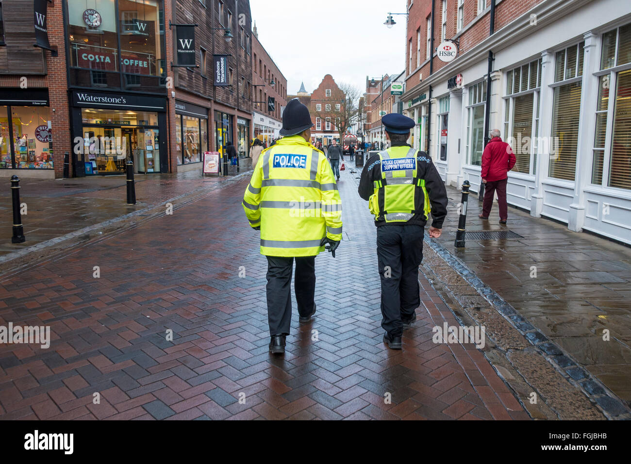Police Officer and Police Community Support Officer on Foot Patrol Stock Photo