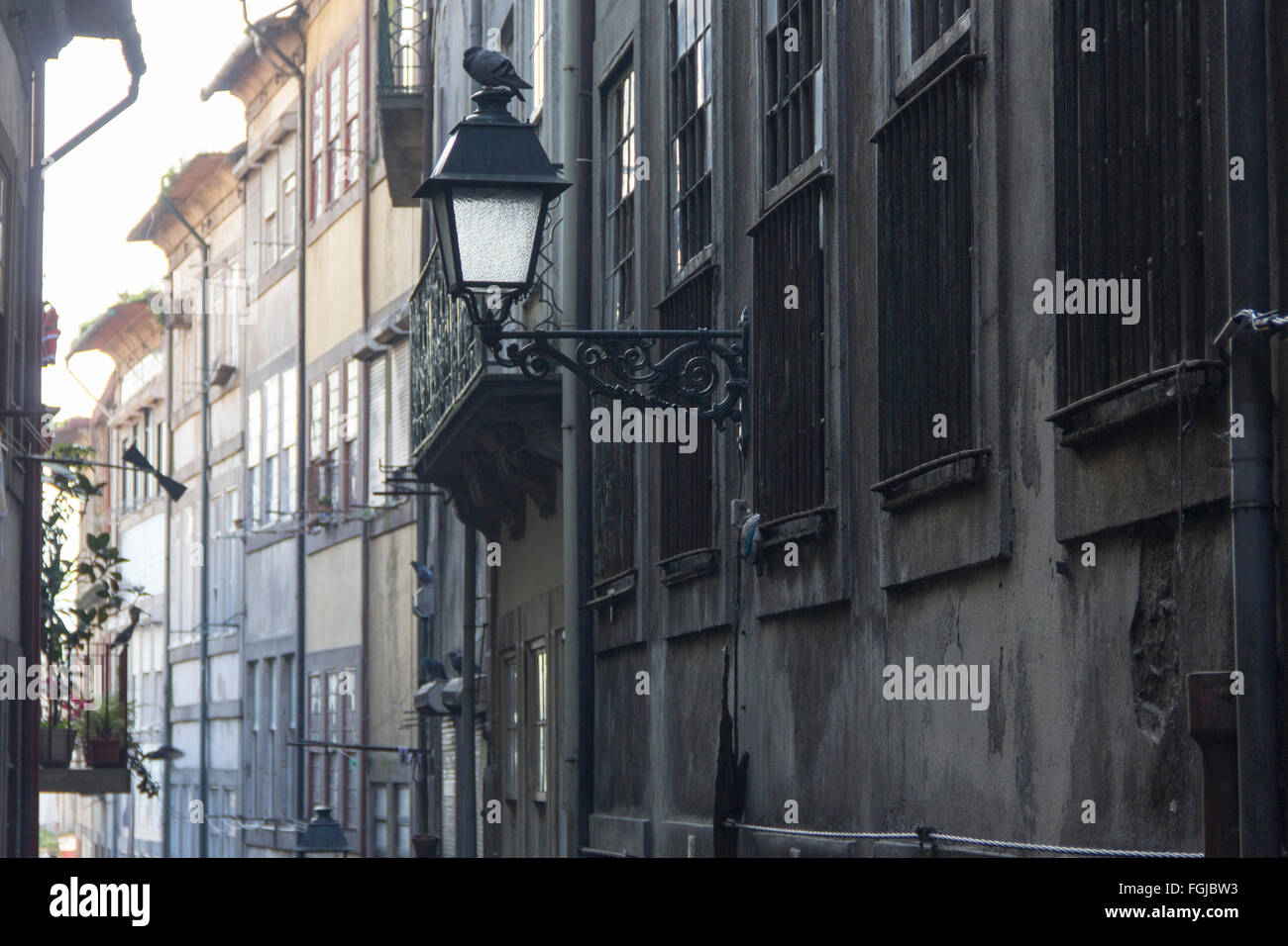 street, road, way, alley, lane, pass, narrow, historic city, oporto, porto, walls, light, sun entering Stock Photo