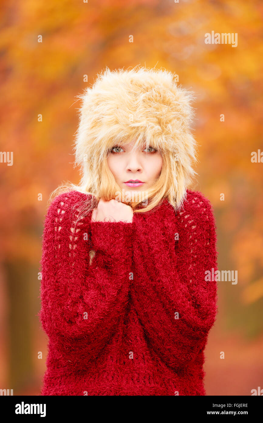 Fall Cold Pretty Portrait of pretty fashionable woman in fall forest park feeling cold ...