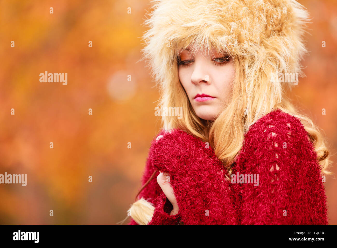 Fall Cold Pretty Portrait of pretty fashionable woman in fall forest park feeling cold ...