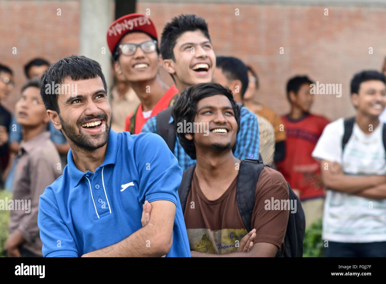 Happy Nepali students seeing a drone fly for the first time Stock Photo