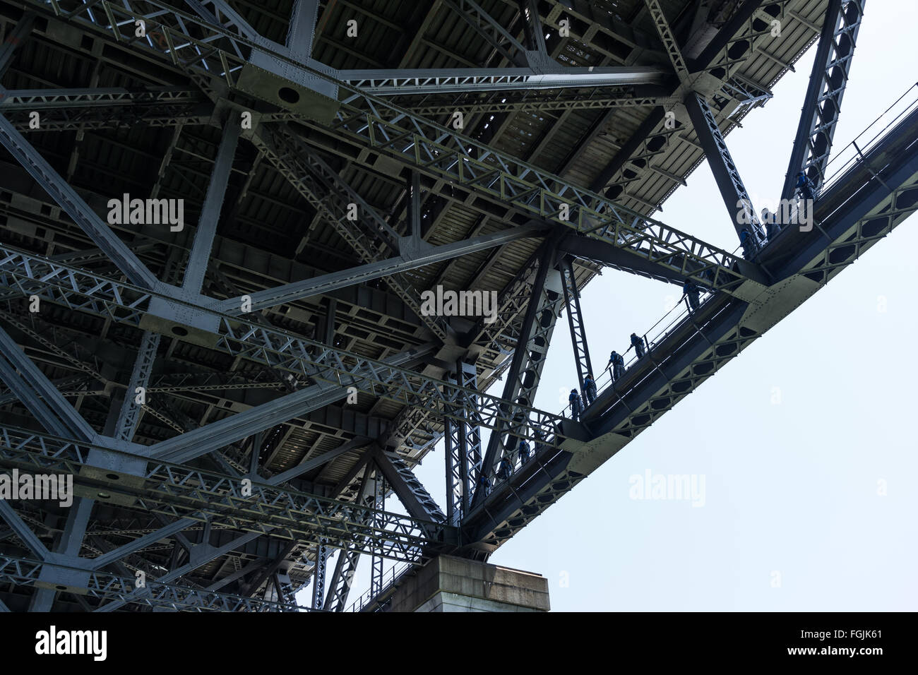 Walkers proceeding on the lower deck of the Sydney Harbour Bridge during a Bridge Climb Stock Photo