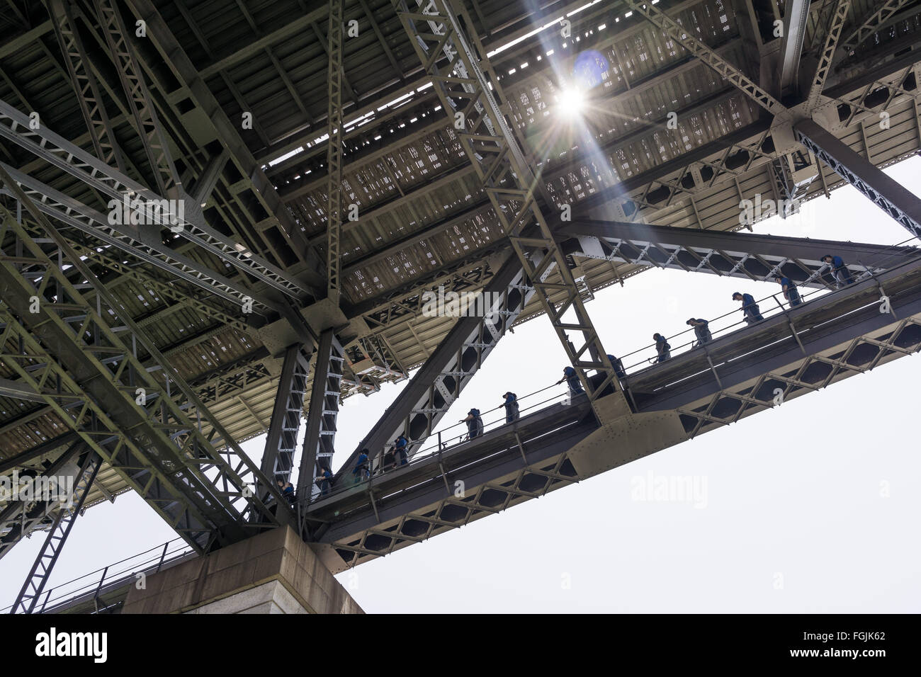 Walkers doing the Sydney Harbour Bridge Climb walking on the lower deck Stock Photo