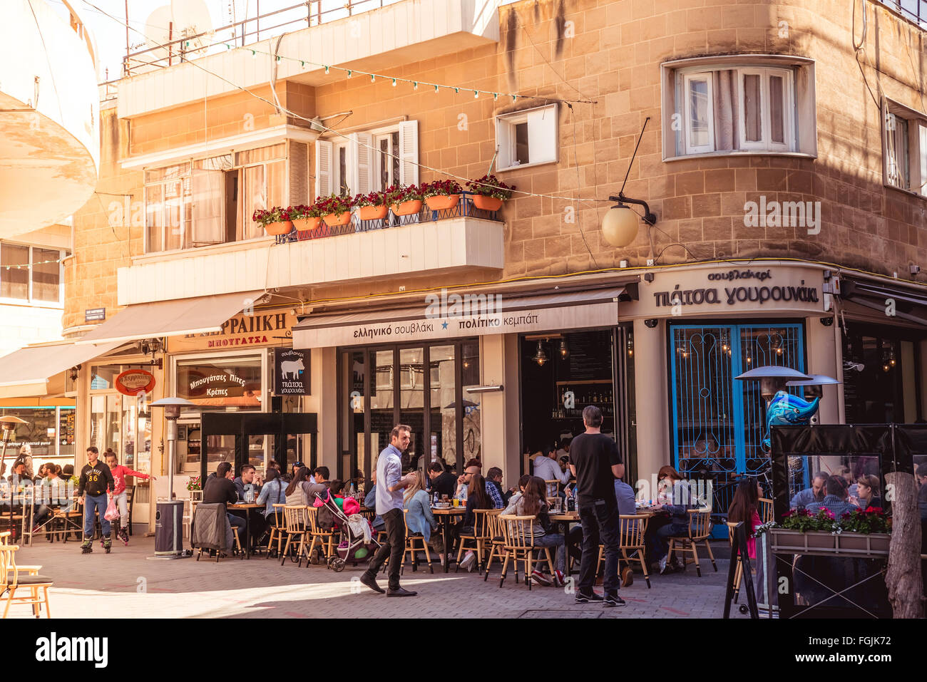 NICOSIA - APRIL 13 : People in restaurants and traditional coffee shops at Faneromenis street on April 13, 2015 in Nicosia, Cypr Stock Photo