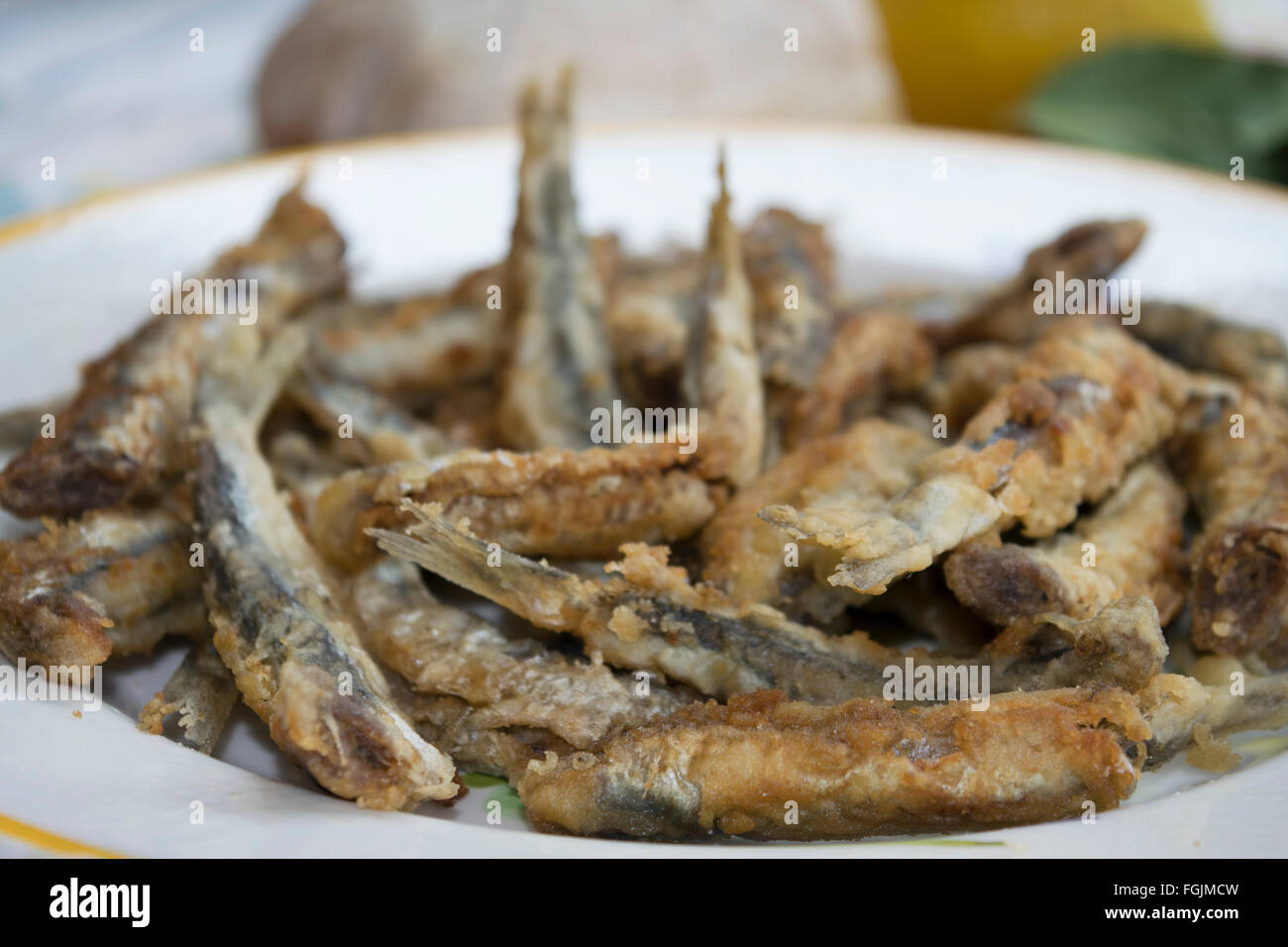 fresh anchovy fillets floured and fried Stock Photo Alamy