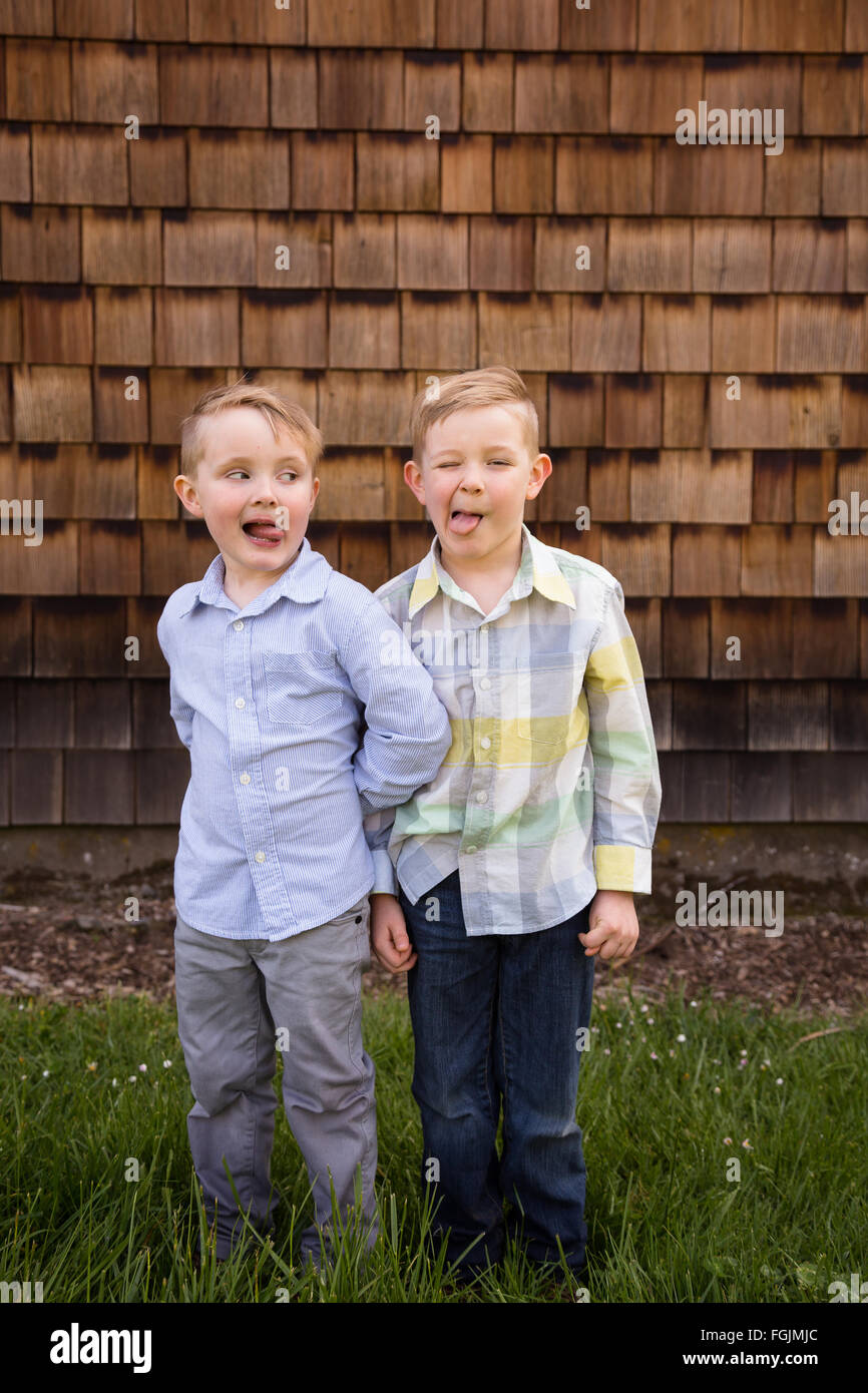 Two brothers together outdoors in a lifestyle portrait with natural light. Stock Photo