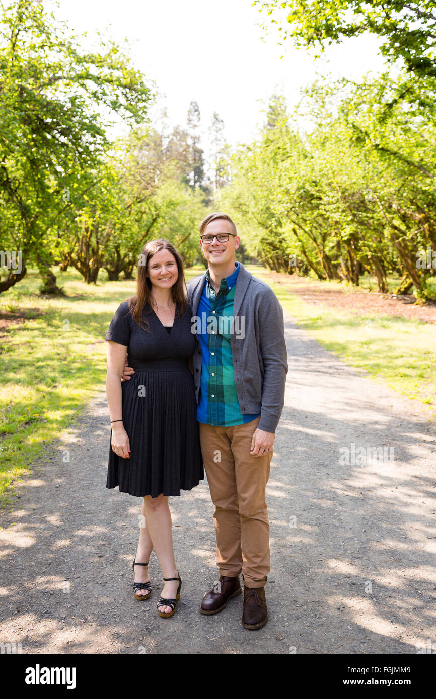 Lifestyle portrait of a happy couple outdoors with natural light. Stock Photo