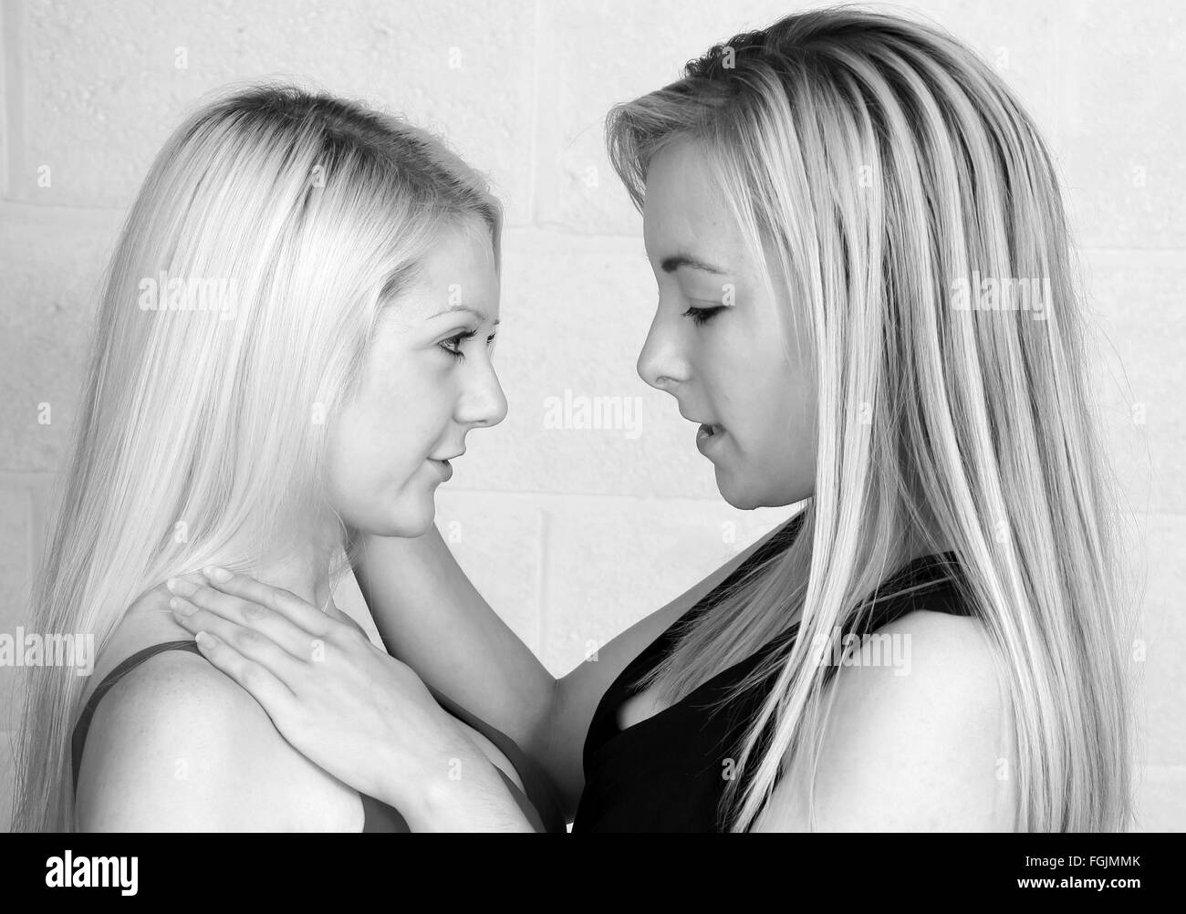 Two young women physically attracted to each other and getting passionate September 2015 Stock Photo