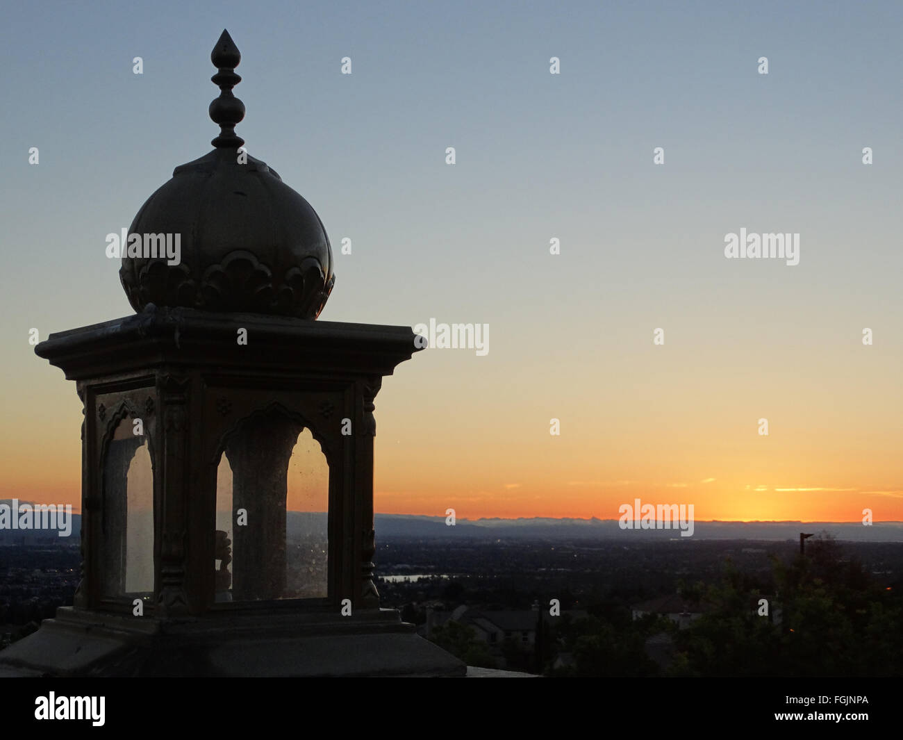 Sunset view of San Jose city and Bay with orange skyline, view from Sikh Gurdwara atop hill Stock Photo