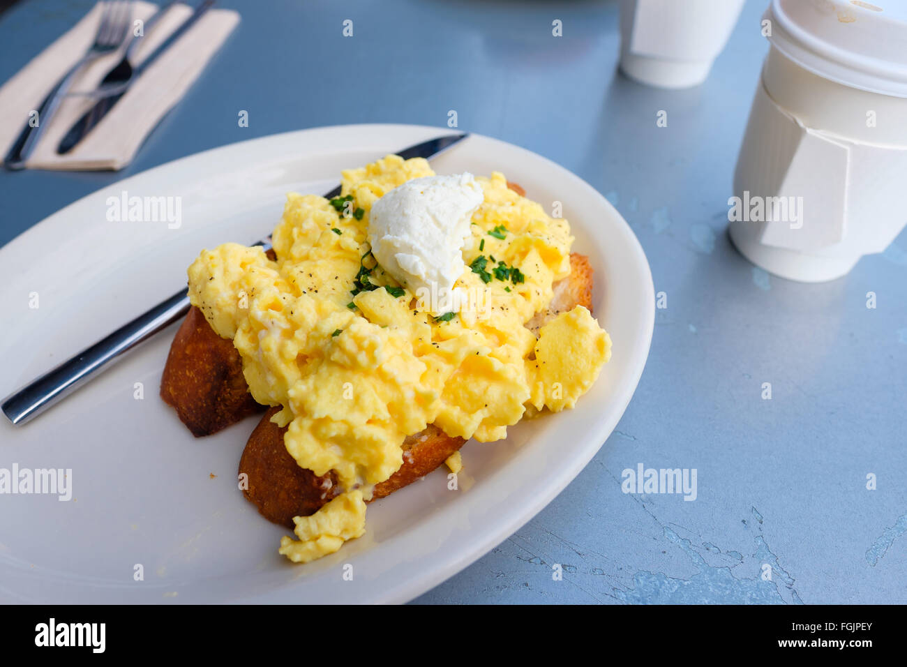 Breakfast plate of scrambled eggs on toast Stock Photo - Alamy