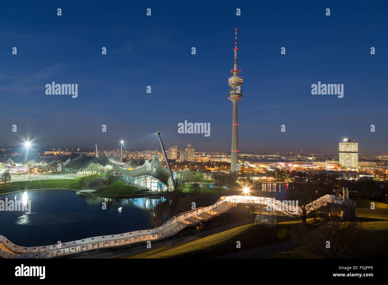 Olympic Park with Olympic Tower, Olympic Hall, Olympic Swimming Pool, Olympic Lake and BMW headquarters in evening light, Munich Stock Photo